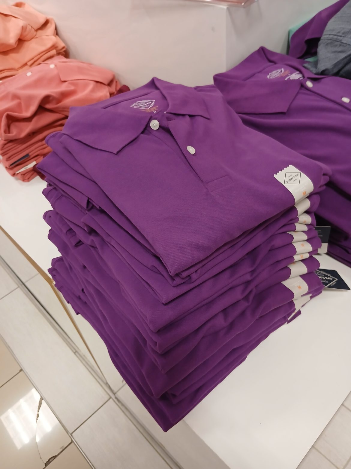 Stack of golf polo shirts