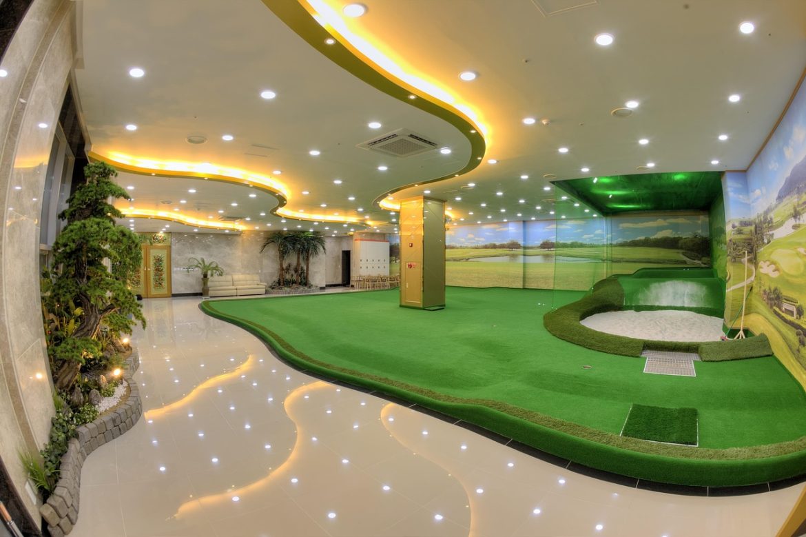 Calibrating Your Launch Monitor for Best Results Indoor screen golf simulator with putting surface and projected course display